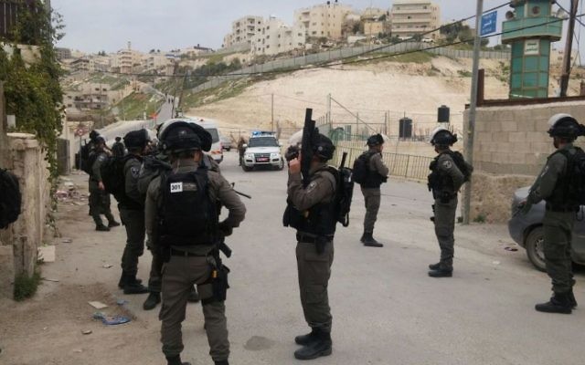 Police units move into the Jabel Mukaber neighborhood of southeast Jerusalem before sealing off the home of a terrorist on March 22, 2017. (Israel Police) Police units move into the Jabel Mukaber neighborhood of southeast Jerusalem before sealing off the home of a terrorist on March 22, 2017. (Israel Police)