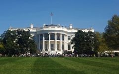 In this April 17, 2016 file photo, people visit the south lawn during the annual White House Spring Garden tours in Washington. The US Secret Service says a person is under arrest after climbing a fence and getting onto the south grounds of the White House.  (AP Photo/Estelle Doro)