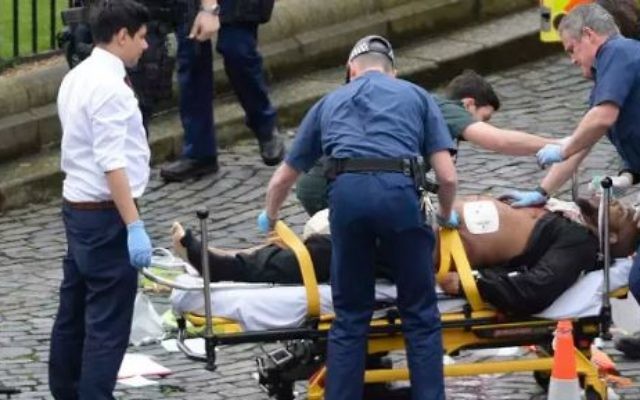 A man is treated by emergency services outside the British Parliament in London on Wednesday March 22, 2017. Reports claim this man to be responsible for the attack that killed three. (Screen capture/YouTube) A man is treated by emergency services outside the British Parliament in London on Wednesday March 22, 2017. Reports claim this man to be responsible for the attack that killed three. (Screen capture/YouTube)