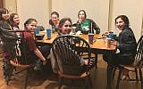 Sophie Golden, in striped shirt and headband, uses social media to coordinate meet-ups with her camp friends. (Davina Golden/via JTA)