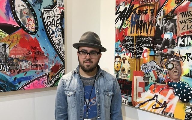 Erez Safar at Scope, a New York showcase for artists. (Madison Margolin/Times of Israel)