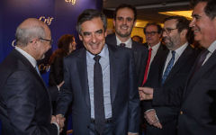 Francois Fillon, with open jacket, shaking hands with CRIF President Francis Kalifat in Paris, March 14, 2017. (Courtesy CRIF via JTA)
