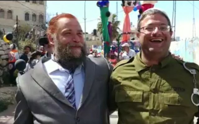 Attorney Itamar Ben Gvir (R) dressed up as IDF solider Elor Azaria, and Lehava leader Bentzi Gopstein dressed up as US President Donald Trump, attend a Purim celebration in the West Bank city of Hebron on March 12, 2017. (screen capture: Channel 10) Attorney Itamar Ben Gvir (R) dressed up as IDF solider Elor Azaria, and Lehava leader Bentzi Gopstein dressed up as US President Donald Trump, attend a Purim celebration in the West Bank city of Hebron on March 12, 2017. (screen capture: Channel 10)