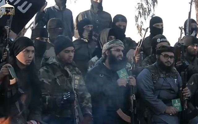 A screen capture from an Islamic State propaganda video, depicting soldiers calling on Muslims to surrender their foreign passports and join the terror group. (YouTube) A screen capture from an Islamic State propaganda video, depicting soldiers calling on Muslims to surrender their foreign passports and join the terror group. (YouTube)