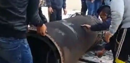 Jordanians inspect the remains of a Syrian missile and an Israeli Arrow interceptor that fell in Jordan on March 17, 2017 (Jordanian government/Petra) Jordanians inspect the remains of a Syrian missile and an Israeli Arrow interceptor that fell in Jordan on March 17, 2017 (Jordanian government/Petra)