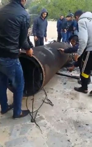 Jordanians inspect the remains of a Syrian missile and an Israeli Arrow interceptor that fell in Jordan on March 17, 2017 (Jordanian government/Petra)