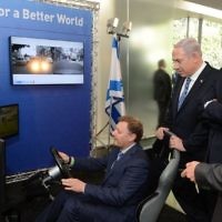 Ziv Aviram, President and CEO of Mobileye, demonstrates the driverless car to Israeli Prime Minister Benjamin Netanyahu (2R) and former US president Barack Obama (C) during an exhibition of technological innovation at the Israel Museum as Amnon Shashua (R), Mobileye‘s co-founder and chief technology officer, looks on,  Jerusalem, March 21, 2013.  Amnon Shashua,  Photo by Kobi Gideon / GPO /FLASH90