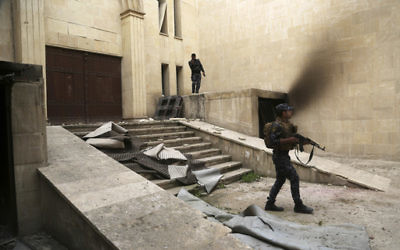 Iraqi federal police inspect Mosul's heavily damaged museum in western Mosul, Iraq, Wednesday, March 8, 2017. (Khalid Mohammed/AP)