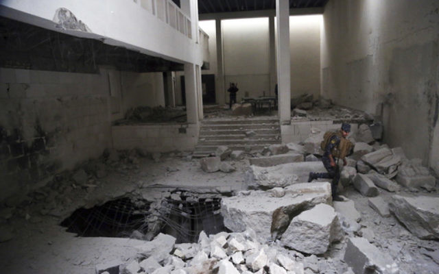 Iraqi federal police inspect the inside of Mosul's heavily damaged museum in western Mosul, Iraq, Wednesday, March 8, 2017. (Khalid Mohammed/AP) Iraqi federal police inspect the inside of Mosul's heavily damaged museum in western Mosul, Iraq, Wednesday, March 8, 2017. (Khalid Mohammed/AP)