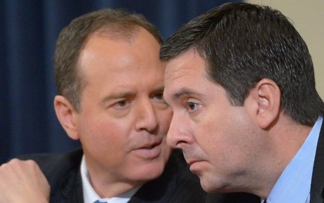 Ranking member Rep. Adam Schiff (D-CA) and chairman Rep. Devin Nunes (R-CA) (R) speak during the House Permanent Select Committee on Intelligence hearing on Russian actions during the 2016 election campaign on March 20, 2017 on Capitol Hill in Washington, DC.  / AFP PHOTO / Mandel Ngan