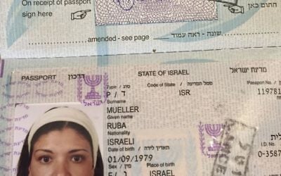 The Israeli passport of a Jerusalem-born Palestinian, Israeli Ruba Mueller, stamped as cancelled because she left Israel immediately after obtaining it 10 years ago, March 14, 2017. (AP Photo/Karin Laub) The Israeli passport of a Jerusalem-born Palestinian, Israeli Ruba Mueller, stamped as cancelled because she left Israel immediately after obtaining it 10 years ago, March 14, 2017. (AP Photo/Karin Laub)