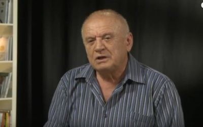 Former Likud minister and Israeli diplomat Avraham Sharir speaks during an August 2014 interview. (screen capture: YouTube)