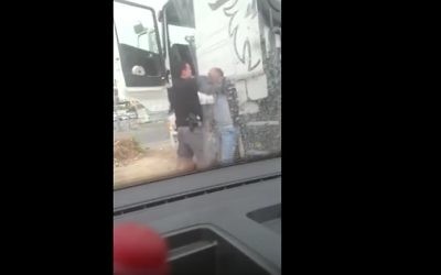 A still from a video showing a police officer assaulting an East Jerusalem truck driver (YouTube screenshot)