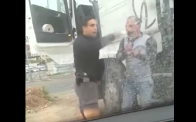 Moshe Cohen, of the Yasam special police force, filmed assaulting Arab truck driver Mazen Shwieki (Screen capture: YouTube) Moshe Cohen, of the Yasam special police force, filmed assaulting Arab truck driver Mazen Shwieki (Screen capture: YouTube)
