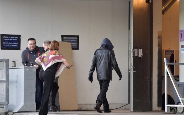 A person assumed to be Bob Dylan, wearing a black jacket and a hoodie, enters the backstage door at Stockholm Waterfront April 1, 2017 (AFP PHOTO / TT News Agency / Jessica GOW) A person assumed to be Bob Dylan, wearing a black jacket and a hoodie, enters the backstage door at Stockholm Waterfront April 1, 2017 (AFP PHOTO / TT News Agency / Jessica GOW)