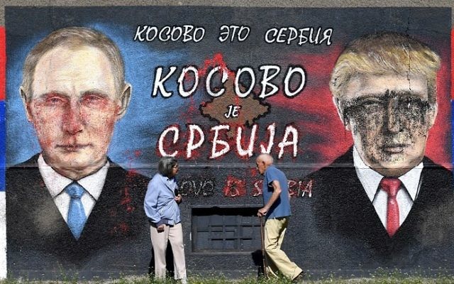 People walk past a wall depicting Russian President Vladimir Putin (L) and US President Donald Trump with a message in cyrillic letters reading "Kosovo is Serbia" in Belgrade on April 2, 2017. (AFP Photo/Andrej Isakovic) People walk past a wall depicting Russian President Vladimir Putin (L) and US President Donald Trump with a message in cyrillic letters reading "Kosovo is Serbia" in Belgrade on April 2, 2017. (AFP Photo/Andrej Isakovic)