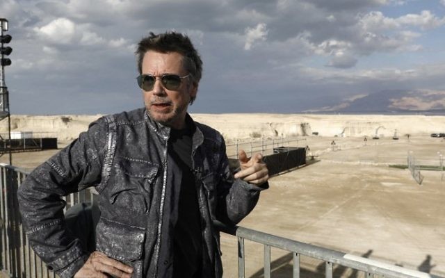 French electronic music pioneer Jean-Michel Jarre speaks during an interview as he prepares for his upcoming concert to publicise the plight of the shrinking Dead Sea at the ancient clifftop fortress of Massada, on April 2, 2017. (Menahem Kahana/AFP) French electronic music pioneer Jean-Michel Jarre speaks during an interview as he prepares for his upcoming concert to publicise the plight of the shrinking Dead Sea at the ancient clifftop fortress of Massada, on April 2, 2017. (Menahem Kahana/AFP)
