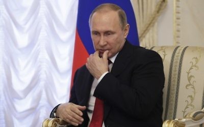 Russian President Vladimir Putin attends a meeting with his Belarusian counterpart in Saint Petersburg on April 3, 2017. (AFP Photo/Pool/Dmitri Lovetsky)