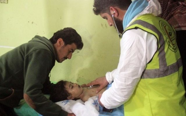 An unconscious Syrian child receives treatment at a hospital in Khan Sheikhun, a rebel-held town in the northwestern Syrian Idlib province, following a suspected toxic gas attack on April 4, 2017. (AFP/Omar Haj Kadour) An unconscious Syrian child receives treatment at a hospital in Khan Sheikhun, a rebel-held town in the northwestern Syrian Idlib province, following a suspected toxic gas attack on April 4, 2017. (AFP/Omar Haj Kadour)