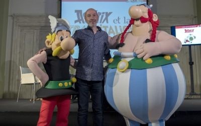 French comics writer, designer and colourist Jean-Yves Ferri poses with comic book characters Asterix, left, and Obelix, right, after a press conference 37th album of the Asterix series in Bologne, April 5, 2017. (AFP/MIGUEL MEDINA)