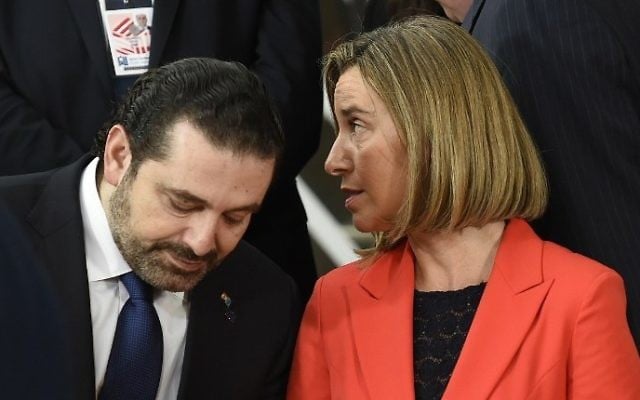 Lebanese Prime minister Saad Al Hariri , left, listens to EU High Representative of the Union for Foreign Affairs and Security Policy Federica Mogherini ahead of a conference on Syria and the region, in Brussels, April 5, 2017. (AFP/JOHN THYS)
