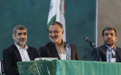 Iranian presidential candidates Ezzatollah Zarghami (R), Alireza Zakani (C) and Ali Nikzad (L) attend the general assembly of conservatives, in Tehran, on April 6, 2017 to decide on a shortlist of five candidates for the presidential election. (AFP/STR)