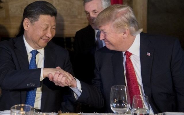 US President Donald Trump (R) and Chinese President Xi Jinping (L) shake hands during dinner at the Mar-a-Lago estate in West Palm Beach, Florida, on April 6, 2017. (AFP Photo/Jim Watson) US President Donald Trump (R) and Chinese President Xi Jinping (L) shake hands during dinner at the Mar-a-Lago estate in West Palm Beach, Florida, on April 6, 2017. (AFP Photo/Jim Watson)