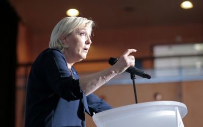 French presidential election candidate for the far-right Front National party Marine Le Pen delivers a speech during a campaign meeting at the Palais des Congres in Ajaccio on the French Mediterranean island of Corsica, on April 8, 2017. (AFP Photo/Pascal Pochard-Casabianca)