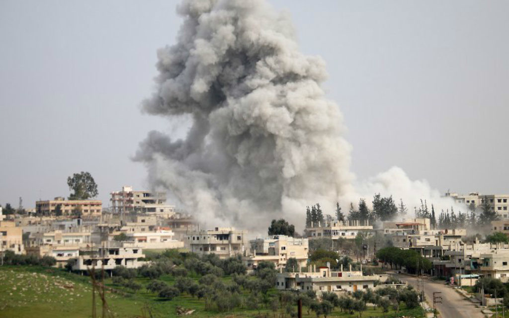 Illustrative: Smoke billows following a reported air strike on a rebel-held area in the southern Syrian city of Daraa, on April 8, 2017. (Mohamad Abazeed/AFP)