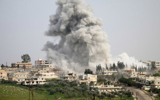 Smoke billows following a reported air strike on a rebel-held area in the southern Syrian city of Daraa, on April 8, 2017. (Mohamad Abazeed/AFP)