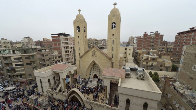 A general view shows people gathering outside the Mar Girgis Coptic Church in the Nile Delta City of Tanta, north of Cairo, after a bomb blast struck worshippers gathering to celebrate Palm Sunday on April 9, 2017. (AFP Photo/Khaled Desouki) A general view shows people gathering outside the Mar Girgis Coptic Church in the Nile Delta City of Tanta, north of Cairo, after a bomb blast struck worshippers gathering to celebrate Palm Sunday on April 9, 2017. (AFP Photo/Khaled Desouki)