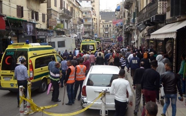Egyptians gather at near a church in Alexandria after a bomb blast struck worshippers gathering to celebrate Palm Sunday on April 9, 2017. (AFP Photo/ Stringer) Egyptians gather at near a church in Alexandria after a bomb blast struck worshippers gathering to celebrate Palm Sunday on April 9, 2017. (AFP Photo/ Stringer)