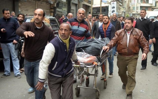 Egyptians wheel away a body near a church in Alexandria after a bomb blast struck worshippers gathering to celebrate Palm Sunday on April 9, 2017. (AFP Photo/Stringer) Egyptians wheel away a body near a church in Alexandria after a bomb blast struck worshippers gathering to celebrate Palm Sunday on April 9, 2017. (AFP Photo/Stringer)