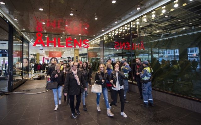 People are pictured at the Ahlens department store where a truck drove into in Stockholm, Sweden, on April 10, 2017. (AFP PHOTO / Jonathan NACKSTRAND) People are pictured at the Ahlens department store where a truck drove into in Stockholm, Sweden, on April 10, 2017. (AFP PHOTO / Jonathan NACKSTRAND)