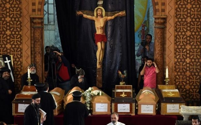 Coptic priests stand near the coffins of victims of the blast at the Coptic Christian Saint Mark's church in Alexandria the previous day during a funeral procession at the Monastery of Marmina in the city of Borg El-Arab, east of the northern port city on April 10, 2017. (AFP Photo/Mohamed El-Shahed) Coptic priests stand near the coffins of victims of the blast at the Coptic Christian Saint Mark's church in Alexandria the previous day during a funeral procession at the Monastery of Marmina in the city of Borg El-Arab, east of the northern port city on April 10, 2017. (AFP Photo/Mohamed El-Shahed)