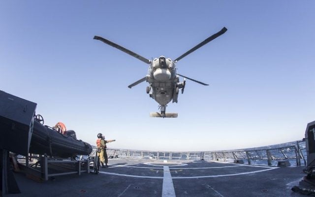 Israeli soldiers onboard the Israeli vessel Saar 5 Class Corvette "INS Hanit" and a Greek helicopter "S-70B" Sea Hawk take part in the "Novel Dina 17" training session in the Mediterranean Sea on April 5, 2017.(AFP PHOTO / JACK GUEZ)