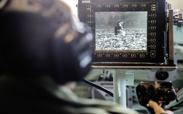 An Israeli soldier onboard the Israeli vessel Saar 5 Class Corvette "INS Hanit" uses a video system called POP to identify ships and airplanes in the distances of several kilometers during the "Novel Dina 17" training session in the Mediterranean Sea on April 4, 2017. (AFP PHOTO / JACK GUEZ)