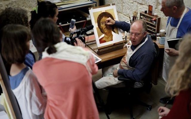 Ian Knowles (C), British director of the Bethlehem Icon Center advises foreign students of the Bethlehem Icon Center during their course, in the biblical West Bank city of Bethlehem on April 11, 2017. (AFP PHOTO / THOMAS COEX) Ian Knowles (C), British director of the Bethlehem Icon Center advises foreign students of the Bethlehem Icon Center during their course, in the biblical West Bank city of Bethlehem on April 11, 2017. (AFP PHOTO / THOMAS COEX)