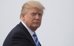 US President Donald Trump boards Air Force One at Andrews Air Force Base, Maryland, April 13, 2017. (AFP Photo/Jim Watson)