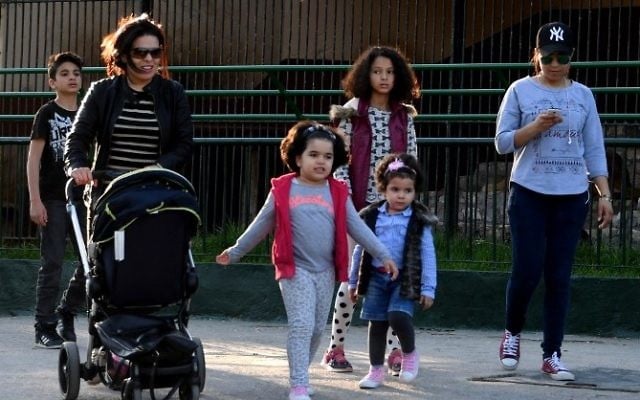 Tunisian visitors walk at the Belvedere Zoo, which was closed for renovation works following an attack on a crocodile a month earlier, in the capital Tunis on April 13, 2017. (AFP/ Fethi Belaid) Tunisian visitors walk at the Belvedere Zoo, which was closed for renovation works following an attack on a crocodile a month earlier, in the capital Tunis on April 13, 2017. (AFP/ Fethi Belaid)