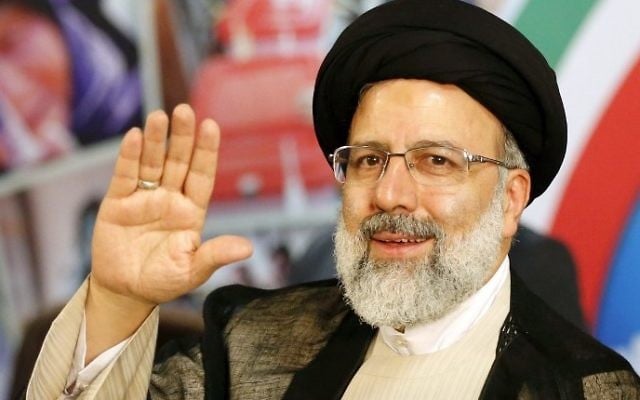 Iranian cleric and head of the Imam Reza charitable foundation, Ebrahim Raisi, gestures after registering his candidacy for the upcoming presidential elections at the ministry of interior in the capital Tehran on April 14, 2017. (AFP/Atta Kenare) Iranian cleric and head of the Imam Reza charitable foundation, Ebrahim Raisi, gestures after registering his candidacy for the upcoming presidential elections at the ministry of interior in the capital Tehran on April 14, 2017. (AFP/Atta Kenare)