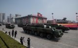 Unidentified missiles and mobile launchers make their way through Kim Il-Sung square during a military parade marking the 105th anniversary of the birth of late North Korean leader Kim Il-Sung in Pyongyang on April 15, 2017. (AFP PHOTO / ED JONES)