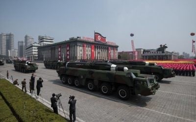 Unidentified missiles and mobile launchers make their way through Kim Il-Sung square during a military parade marking the 105th anniversary of the birth of late North Korean leader Kim Il-Sung in Pyongyang on April 15, 2017. (AFP PHOTO / ED JONES)