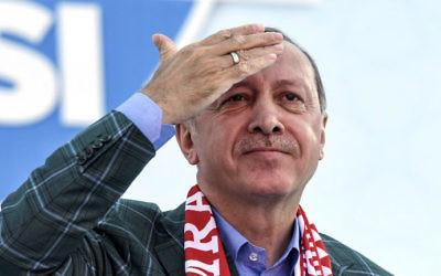 Turkish President Recep Tayyip Erdogan gestures as he delivers a speech during a rally on the eve of the constitutional referendum, on April 15, 2017 in Istanbul. (Bulent Kilic/AFP)