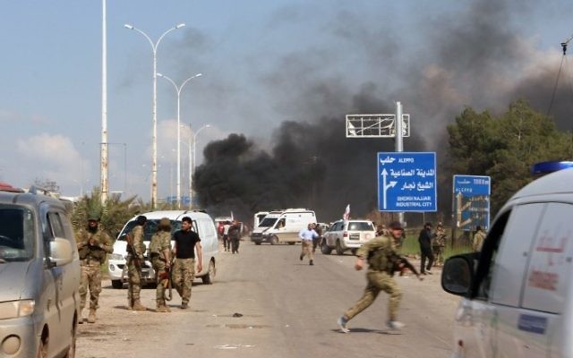 A picture taken on April 15, 2017, shows smoke billowing following a suicide car bombing in Rashidin, west of Aleppo. (AFP Photo/Ibrahim Yasouf) A picture taken on April 15, 2017, shows smoke billowing following a suicide car bombing in Rashidin, west of Aleppo. (AFP Photo/Ibrahim Yasouf)
