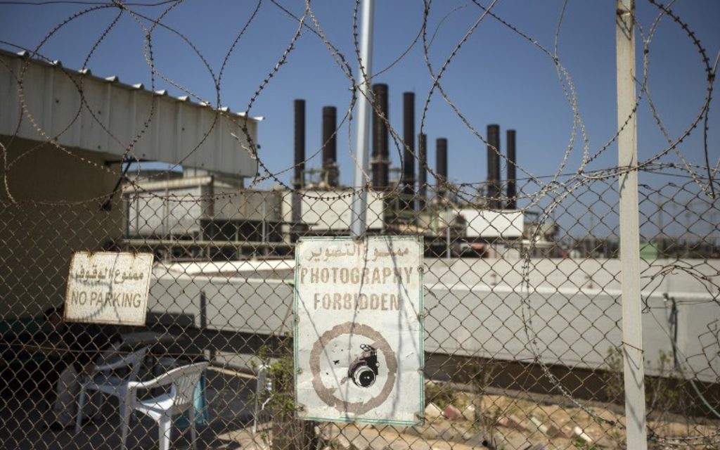 A power plant in Gaza City is pictured from behind a fence on April 16, 2017. (AFP/Mahmud Hams)