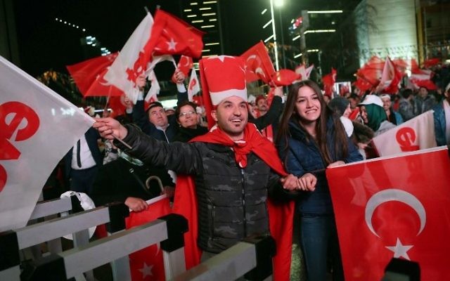 Supporters of Turkey's president celebrate as they wave Turkish flags during a rally near the headquarters of the conservative Justice and Development Party (AKP) on April 16, 2017 in Ankara. (AFP Photo/Adem Altan) Supporters of Turkey's president celebrate as they wave Turkish flags during a rally near the headquarters of the conservative Justice and Development Party (AKP) on April 16, 2017 in Ankara. (AFP Photo/Adem Altan)