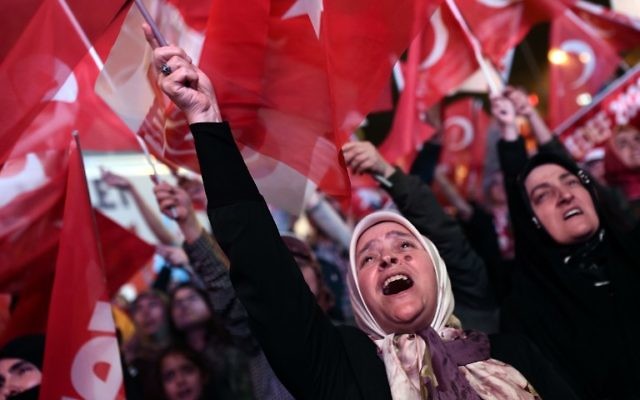 A woman supporting Turkish president waves a Turkish national flag as she celebrates during a rally near the headquarters of the conservative Justice and Development Party (AKP) on April 16, 2017 in Istanbul after the results of a nationwide referendum that will determine Turkey's future destiny. (AFP/Ozan Kose) A woman supporting Turkish president waves a Turkish national flag as she celebrates during a rally near the headquarters of the conservative Justice and Development Party (AKP) on April 16, 2017 in Istanbul after the results of a nationwide referendum that will determine Turkey's future destiny. (AFP/Ozan Kose)