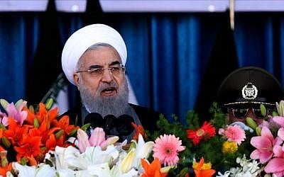 Iranian President Hassan Rouhani delivers a speech during a parade on the occasion of the country's Army Day, on April 18, 2017, in Tehran. (AFP Photo/Atta Kenare)