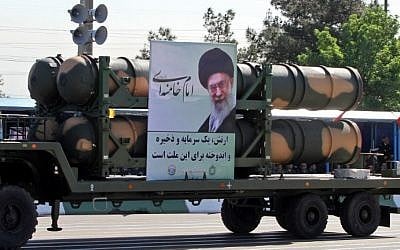 An Iranian military truck carries parts of the S-300 air defense missile system during a parade on the occasion of the country's Army Day, on April 18, 2017, in Tehran. (AFP Photo/Atta Kenare)